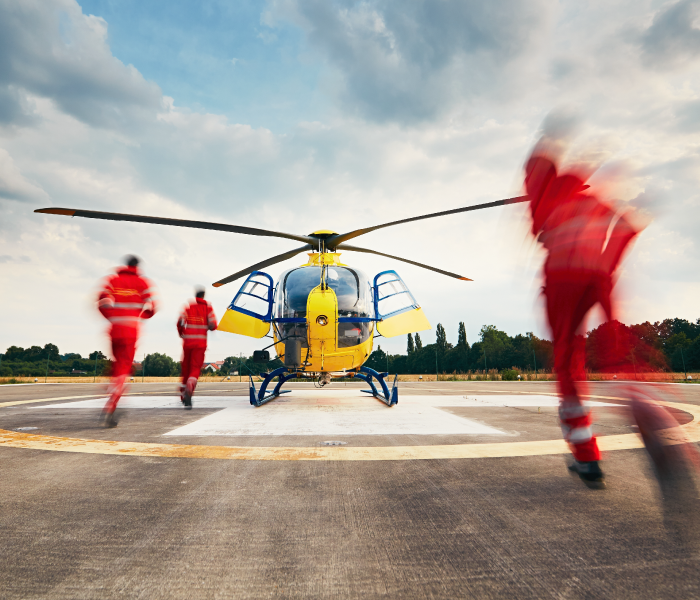 Photo of air ambulance helicopter and rescue team