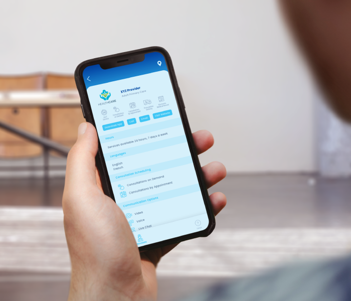 Man holding phone showing app screen